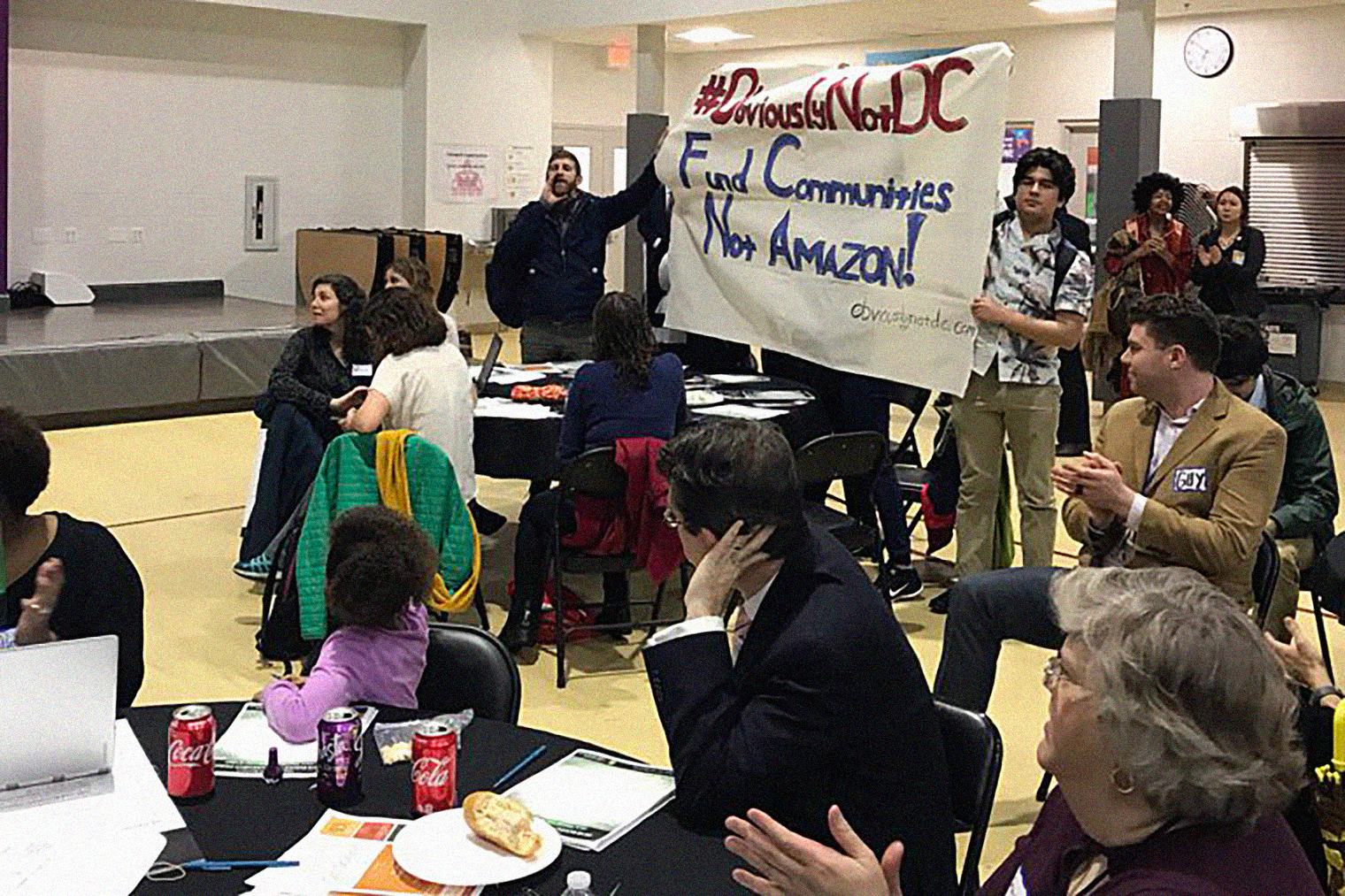 Residents are challenging Mayor Bowser to fund communities, housing, schools and transit, not give away our money to the worlds richest man and Amazon, Watkins Field Recreation Center, Washington, D.C., February 22, 2018.