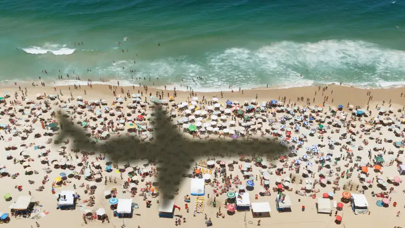 A plane flies over a beach near Rio de Janeiro, Brazil, November 15, 2013.