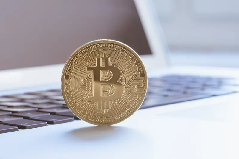 Close-Up Of Bitcoin On Laptop