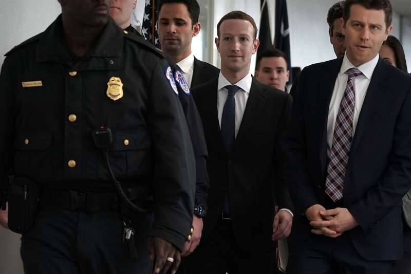 Facebook CEO Mark Zuckerberg (C) arrives at a meeting with U.S. Sen. Bill Nelson (D-FL), ranking member of the Senate Committee on Commerce, Science, and Transportation, April 9, 2018 in Washington, DC.
