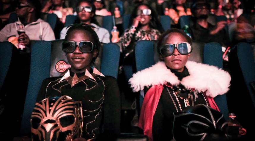 Cosplayers watches the film  Black Panther  in 3D which featuring Oscar-winning Mexico born Kenyan actress Lupita Nyongo during Movie Jabbers Black Panther Cosplay Screening in Nairobi, Kenya, on February 14, 2018.