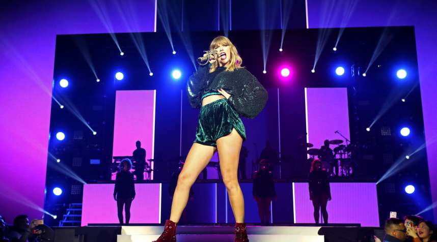 Taylor Swift performs on stage in London.