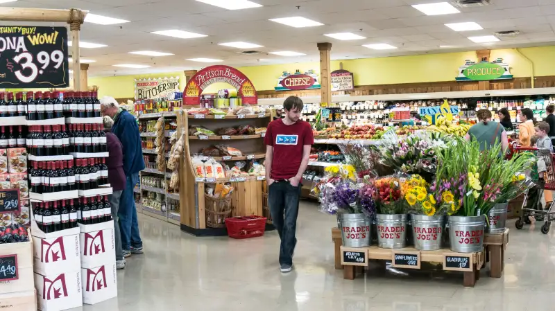 bright colorful spacious interior of Trader Joes market with displays wine fruit artisan bread buckets fresh flowers Lynnwood