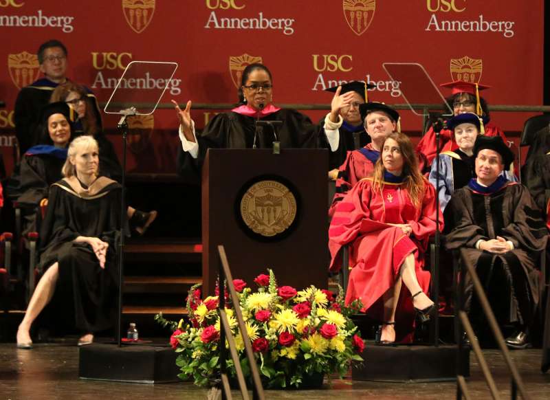 Oprah Winfrey, center, addresses USC Annenberg Class of 2018 at the Shrine Auditorium, in Los Angeles, May 11, 2018.