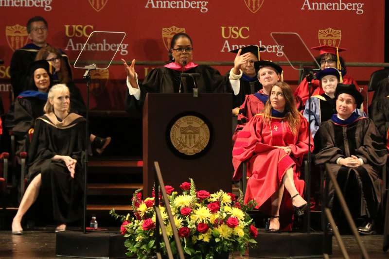 Oprah Winfrey, center, addresses USC Annenberg Class of 2018 at the Shrine Auditorium, in Los Angeles, May 11, 2018.