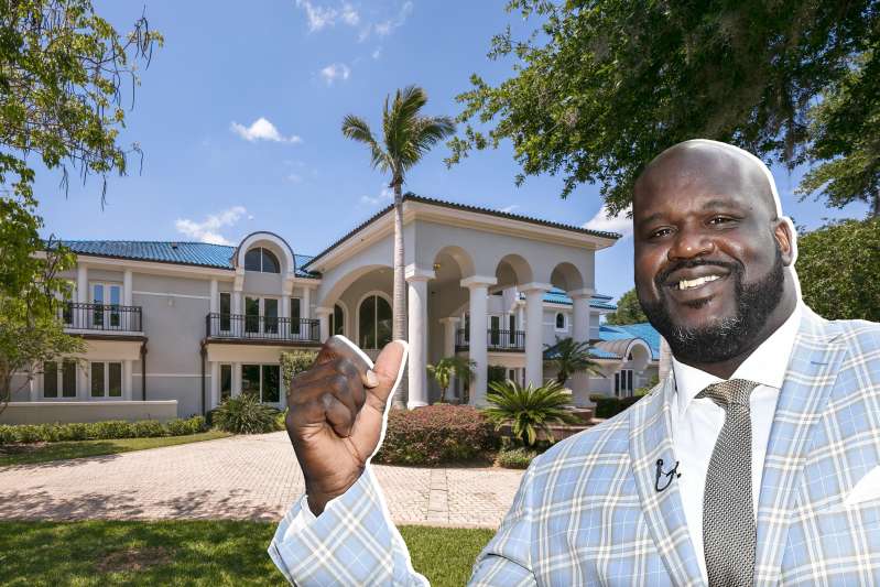 Shaq in front of his home
