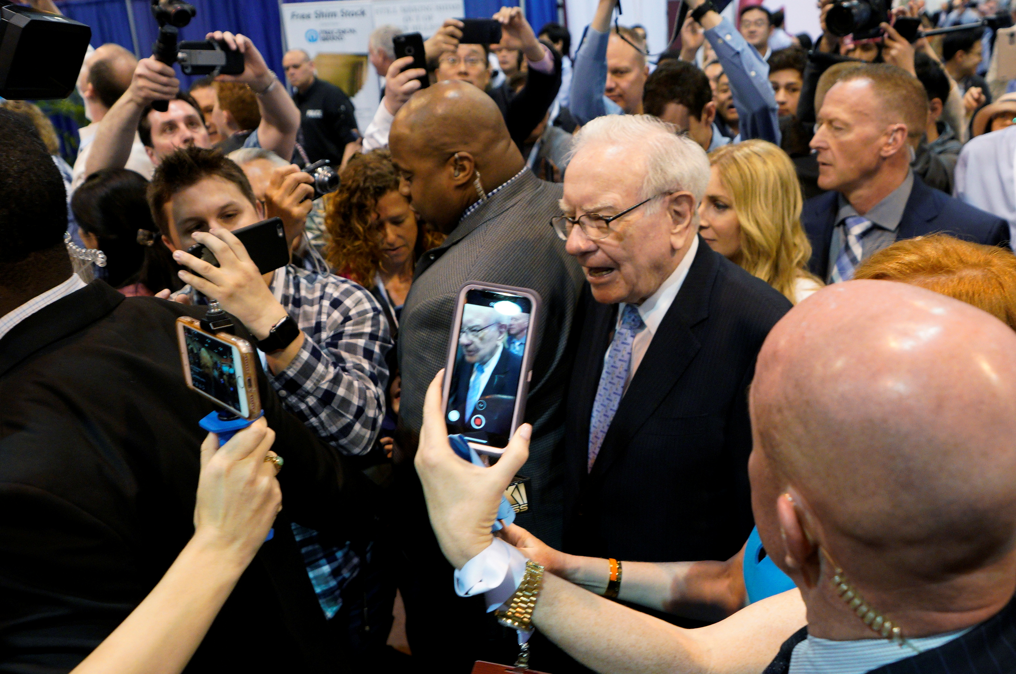 Warren Buffett, CEO of Berkshire Hathaway Inc, walks through the exhibit hall at the company's annual meeting in Omaha