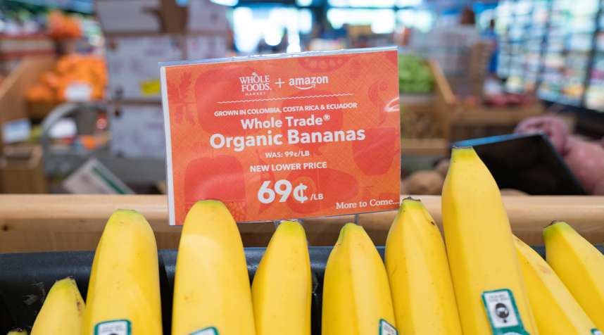 Signage on a display of bananas at a Whole Foods Market store