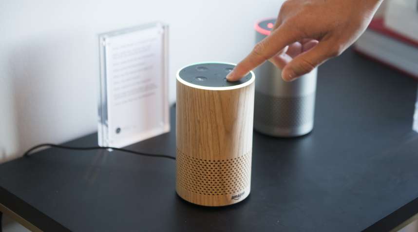 An attendee operates the new Amazon.com Inc. Echo device on display during the company's product reveal launch event in downtown Seattle, Washington, U.S., on Wednesday, Sept. 27, 2017. Amazon unveiled a smaller, cheaper version of its popular Alexa-powered Echo speaker that the e-commerce giant said has better sound.