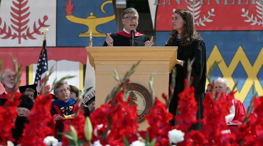 Microsoft founder and chairman Bill Gates speaks as his wife Melinda looks on during the 123rd Stanford University commencement ceremony in 2014.