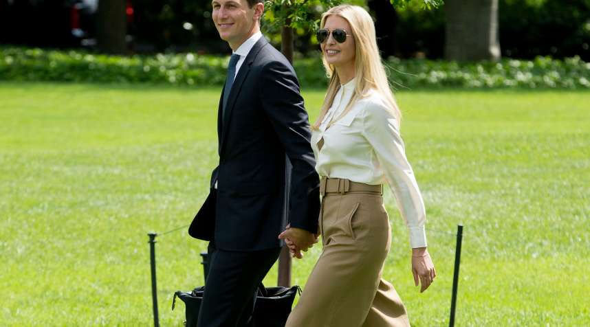 First daughter Ivanka Trump (R) and White House Senior Advisor Jared Kushner (L) walk across the South Lawn of the White House to join US President Donald J. Trump (not pictured) aboard Marine One en route to Camp David, in Washington, DC, June 1 2018.