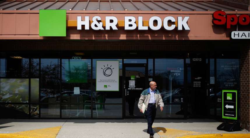 A customer leaves an H&amp;R Block Inc. location in Louisville, Kentucky, U.S., on Thursday, March 23, 2017. H&amp;R Block is one of the largest tax return preparers in the U.S., where it boasts more than 12,000 company-owned and franchised retail locations.