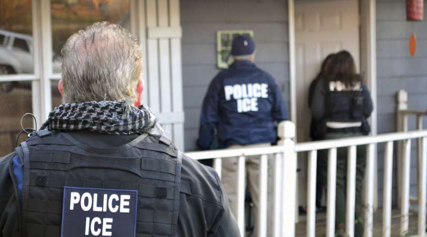 Provided U.S. Immigration and Customs Enforcement, ICE agents at a home in Atlanta, during a targeted enforcement operation aimed at immigration fugitives, re-entrants and at-large criminal aliens, February 9, 2017.