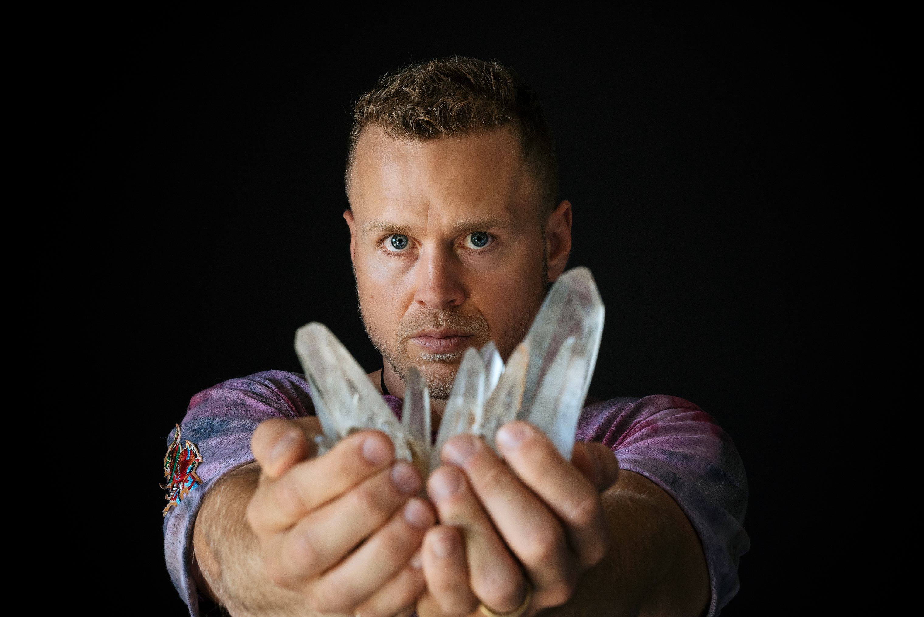 Spencer Pratt holds a lemurian quartz crystal from his collection at his home in the Pacific Palisades neighborhood of Los Angeles, California on Friday, June 22, 2018.