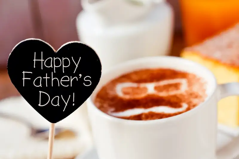 text happy fathers day and a cup of cappuccino