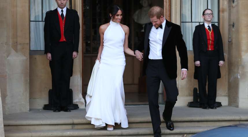 Duchess of Sussex and Prince Harry, Duke of Sussex leave Windsor Castle after their wedding to attend an evening reception at Frogmore House, hosted by the Prince of Wales on May 19, 2018 in Windsor, England.