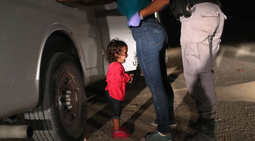 A two-year-old Honduran asylum seeker cries as her mother is searched and detained near the U.S.-Mexico border on June 12, 2018 in McAllen, Texas. The asylum seekers had rafted across the Rio Grande from Mexico and were detained by U.S. Border Patrol agents before being sent to a processing center for possible separation. Customs and Border Protection (CBP) is executing the Trump administration's  zero tolerance  policy towards undocumented immigrants. U.S. Attorney General Jeff Sessions also said that domestic and gang violence in immigrants' country of origin would no longer qualify them for political asylum status.