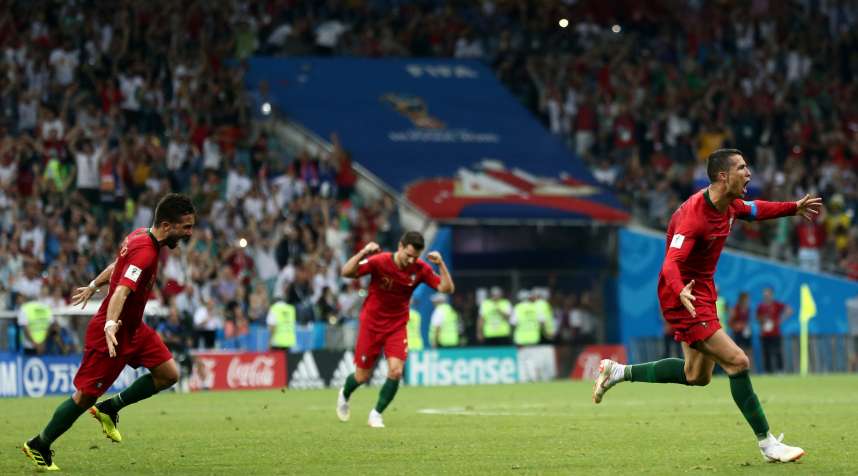 Cristiano Ronaldo #7 of Portugal celebrates after scoring a goal against Spain at the 2018 FIFA World Cup in Russia.