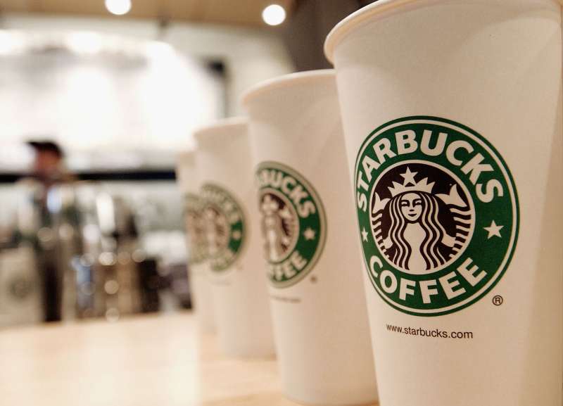 Three disposable coffee cups with the Starbucks logo