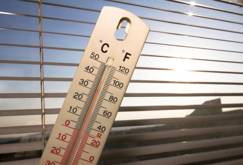summer heat in the city, shown on mercury thermometer