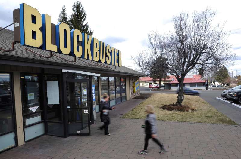 In this March 16, 2018 photo, costumers arrive and leave a Blockbuster video rental store in Bend, Ore.