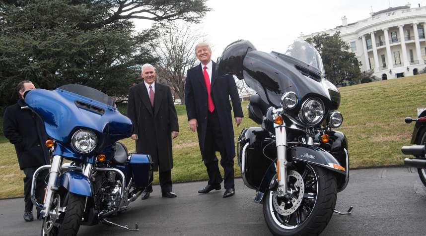 U.S. President Donald Trump jokes with reporters after greeting Harley Davidson executives and union representatives on the South Lawn of the White House in Washington, DC, on February 2, 2017 prior to a luncheon with them.