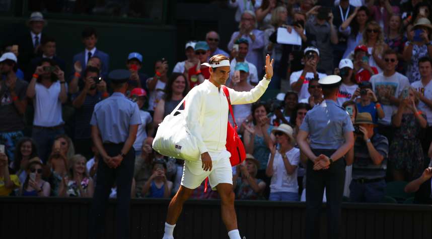 Roger Federer of Switzerland walks out onto the court ahead of his Men's Singles first round match against Dusan Lajovic of Serbia on day one of the Wimbledon Lawn Tennis Championships at All England Lawn Tennis and Croquet Club on July 2, 2018 in London, England.