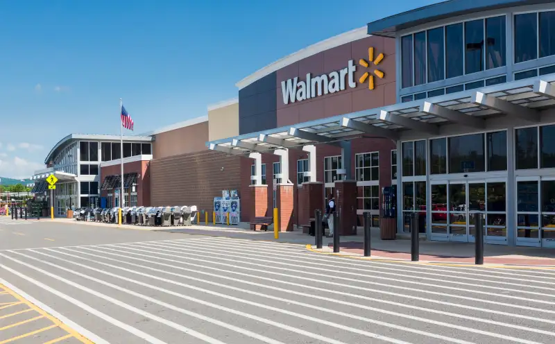 Entrance to large Walmart food supermarket or superstore in Haymarket, Virginia, USA