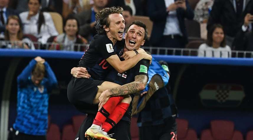 Croatia's Luka Modric and Mario Mandzukic celebrate their World Cup 2018 win over England. The World Cup championship game is France vs. Croatia.