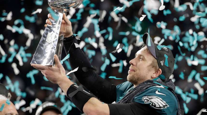 Philadelphia Eagles' Nick Foles holds up the Vince Lombardi Trophy after the NFL Super Bowl 52 football game against the New England Patriots, in Minneapolis. The Eagles won 41-33
                      Eagles Patriots Super Bowl Football, Minneapolis, February 4, 2018.
