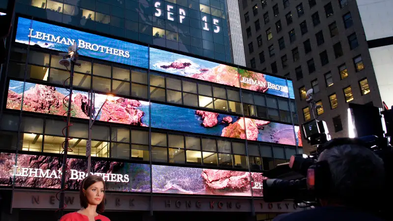 A journalist reports outside the Lehman Brothers building in New York