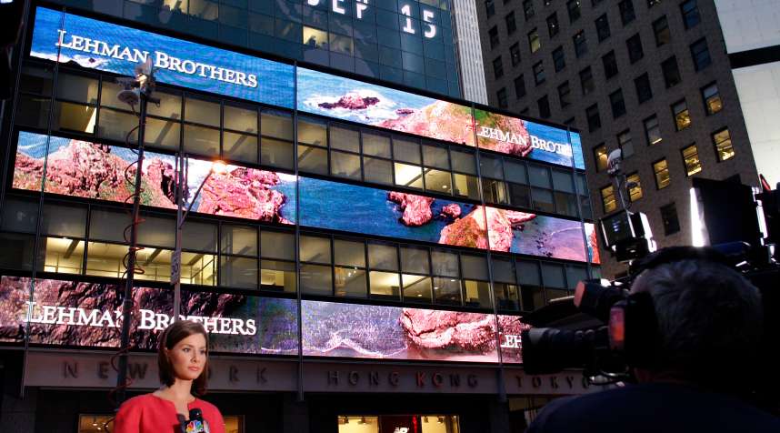 A journalist reports outside the Lehman Brothers building in New York, September 15, 2008.