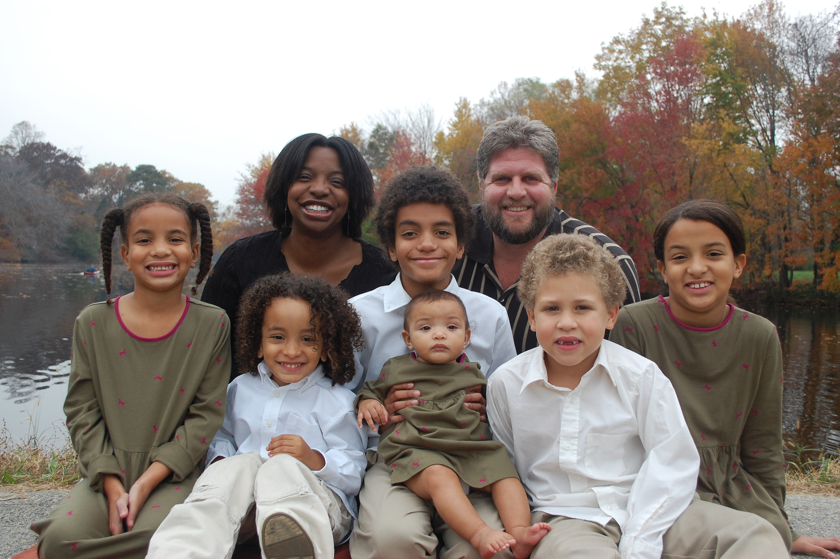 The Malones pose in 2009 in their first portrait as a family of eight.