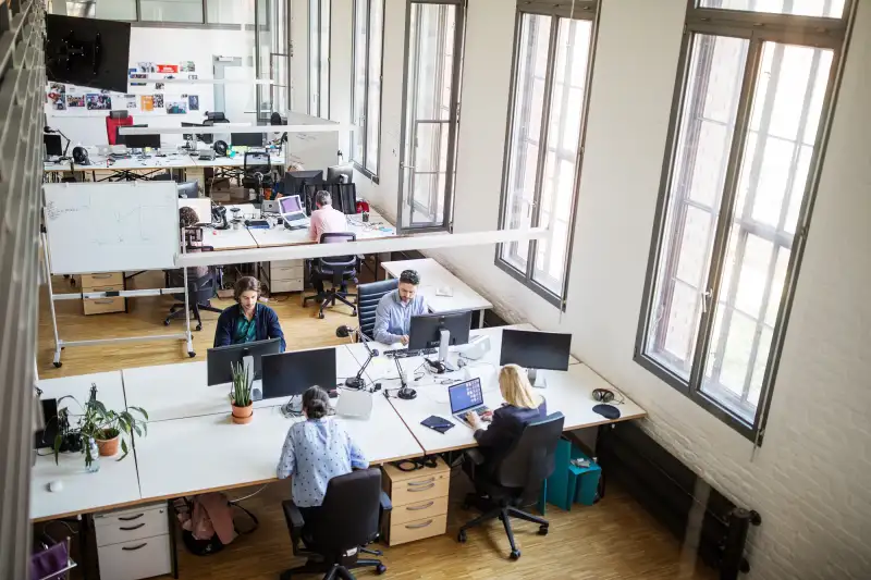 Software developers working on computers at office