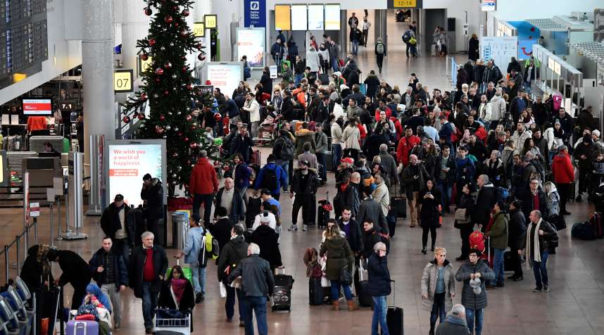 This general view shows travellers gathering at Brussels Airport on December 11, 2017, as cold temperatures sweep across Europe.