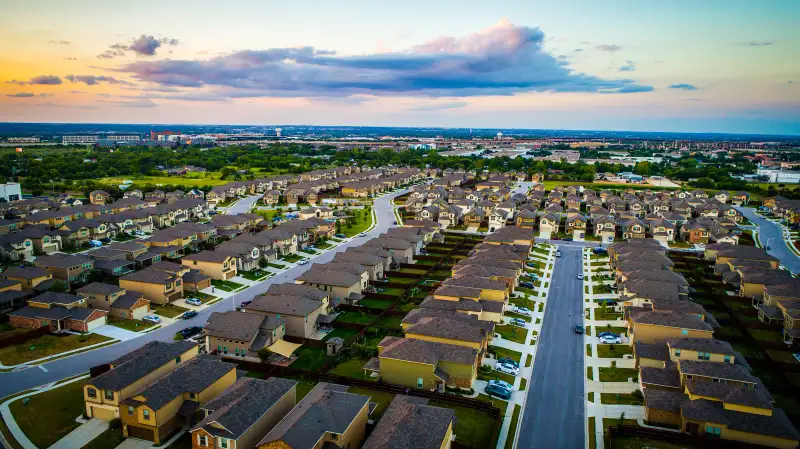 Sunset above modern suburb new homes in Austin