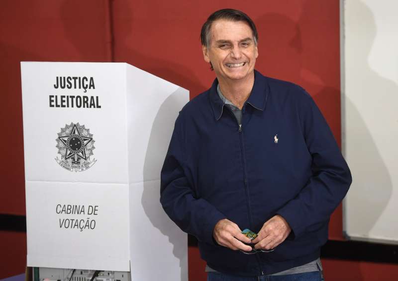 Brazil's right-wing presidential candidate for the Social Liberal Party (PSL) Jair Bolsonaro smiles after casting his vote during general elections, in Rio de Janeiro, Brazil, on October 7, 2018.