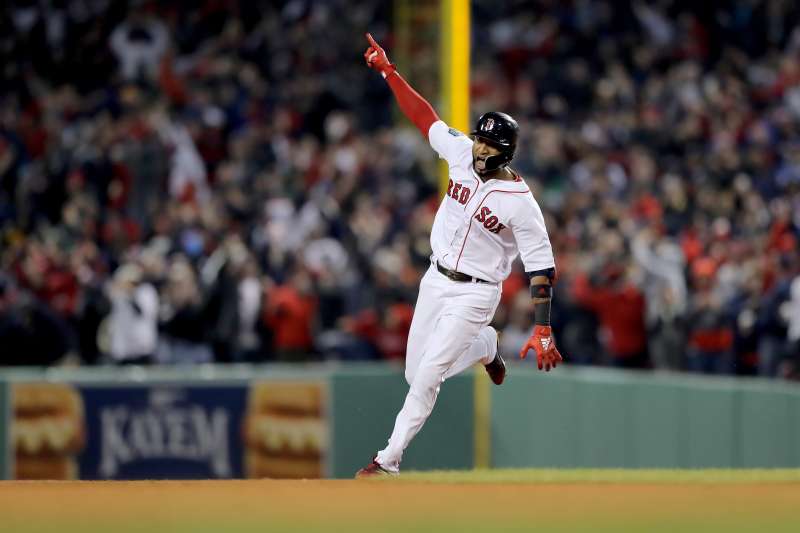 Eduardo Nunez of the Boston Red Sox celebrates his three-run home run against the Los Angeles Dodgers in Game One of the 2018 World Series at Fenway Park on October 23, 2018 in Boston.