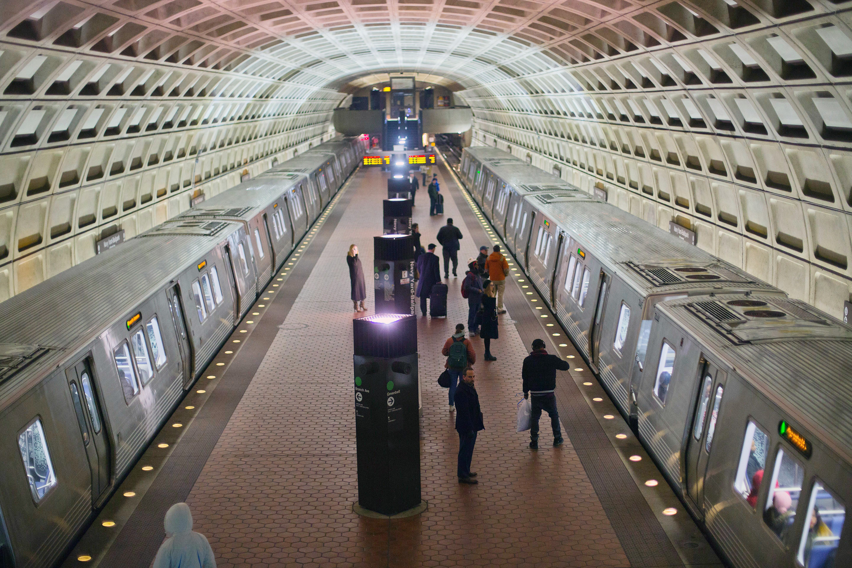 Passengers board subway trains at the Naval Yard-Ballpark Metro Station, part of the public transit network for Washington DC, February 8, 2018.