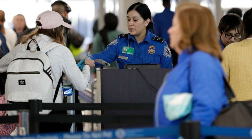 A TSA worker works at O'Hare International Airport in Chicago, December 25, 2018.