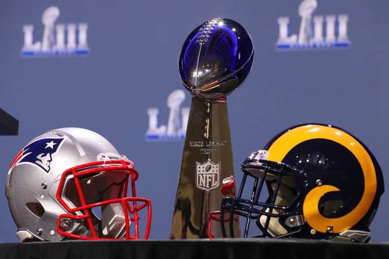 The Vince Lombardi Trophy and New England Patriots and Los Angeles Rams helmets on display during National Football League Commissioner Roger Goodell Press Conference on January 30, 2019 at the Georgia World Congress Center in Atlanta GA.