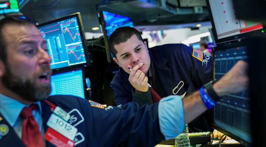 Traders work ahead of the opening bell on the floor of the New York Stock Exchange (NYSE), January 14, 2019.
