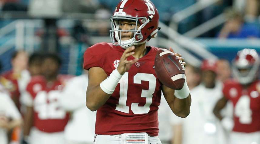 Tua Tagovailoa #13 of the Alabama Crimson Tide looks to pass against the Oklahoma Sooners during the College Football Playoff Semifinal on December 29, 2018.