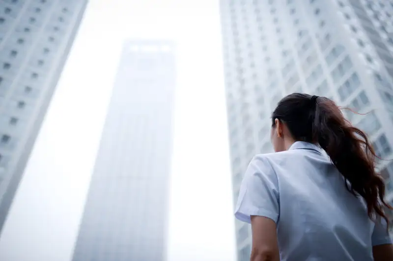 Business Woman with Skyscraper Office Building Background - XXXXXLarge