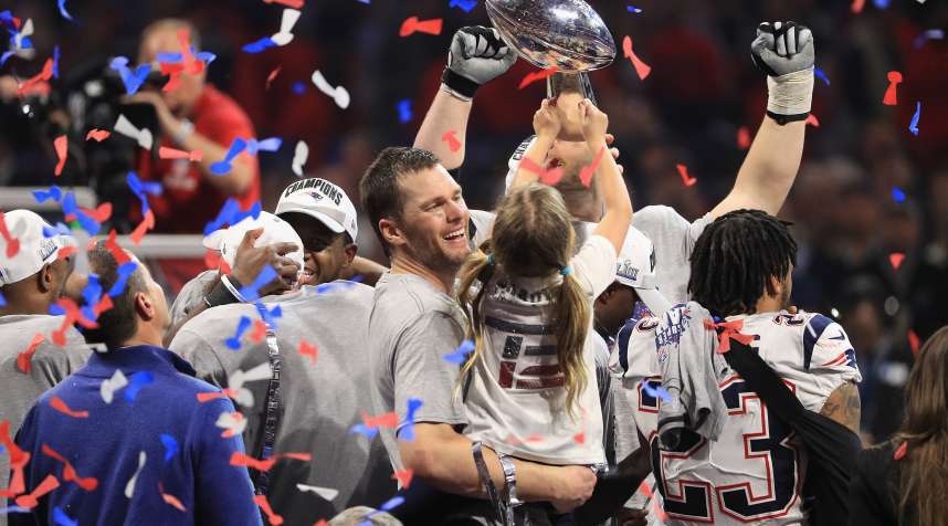 ATLANTA, GA - FEBRUARY 03: Tom Brady #12 of the New England Patriots celebrates with daughter Vivian who raises the Vince Lombardi Trophy after Super Bowl LIII at Mercedes-Benz Stadium on February 3, 2019 in Atlanta, Georgia. The New England Patriots defeat the Los Angeles Rams 13-3.  (Photo by Mike Ehrmann/Getty Images)