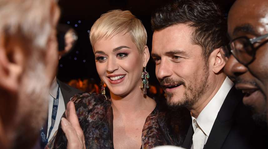 Katy Perry (L)  and Orlando Bloom attend MusiCares Person of the Year honoring Dolly Parton at Los Angeles Convention Center on February 8, 2019 in Los Angeles, California.