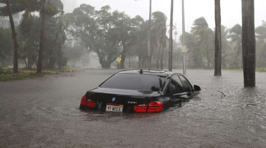 A car is seen in a flooded street as Hurricane Irma passes through on September 10, 2017 in Miami, Florida.