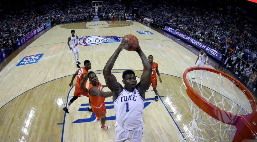Zion Williamson of Duke dunks the ball in an ACC tournament game against Syracuse. Duke is the overall top seed in the 2019 March Madness basketball tournament.