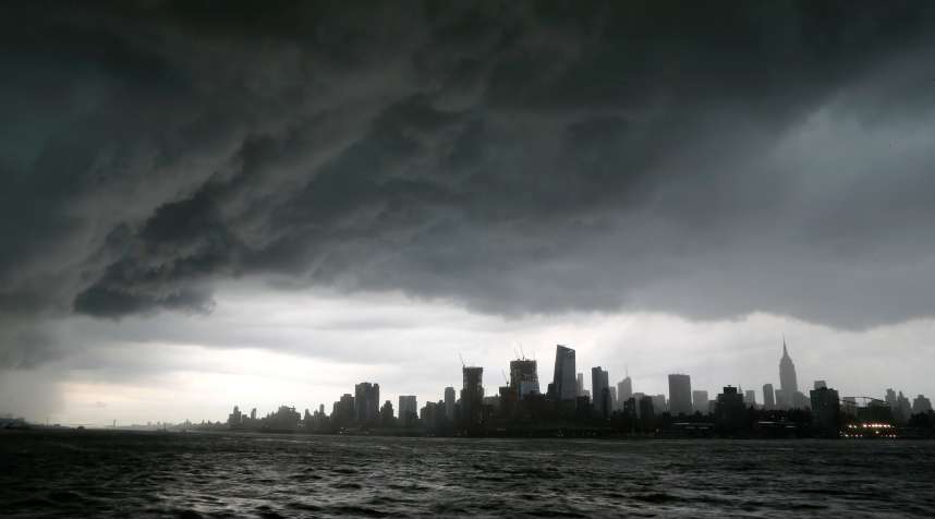 Storm clouds pass over midtown Manhattan and the Empire State Building in New York City