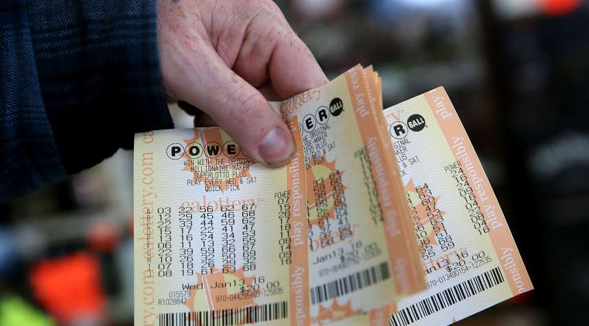 A customer holds a handful of Powerball tickets from January 13, 2016, when the jackpot was $1.5 billion.
